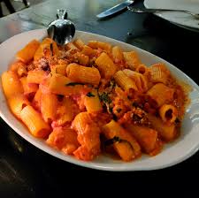 Al Solito Posto signature dishes Spicy Rigatoni alla VodkaChicken ParmigianaMeatballs